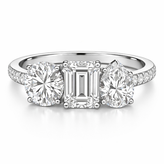 خاتم خطوبة بثلاثة أحجار مستديرة، زمرد وكمثرى